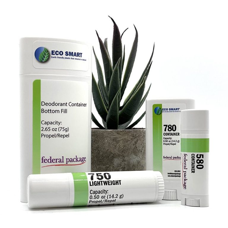 Eco-friendly deodorant containers from the ‘Eco Smart’ line, displayed alongside a potted plant, emphasizing sustainability and green packaging solutions.